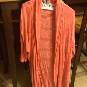 Apricot colored long sweater.